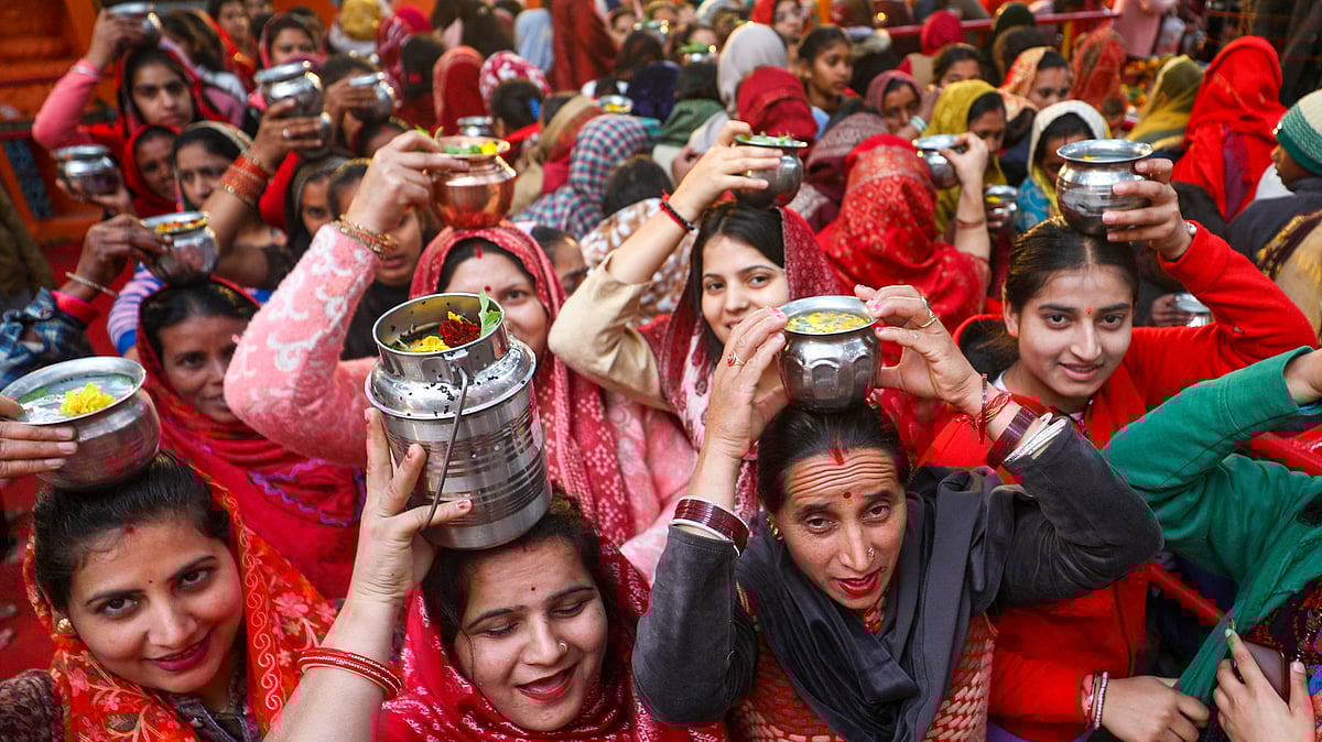 Devotees queue up at the Aap Shambhu temple to offer prayers on Maha Shivratri in Jammu.