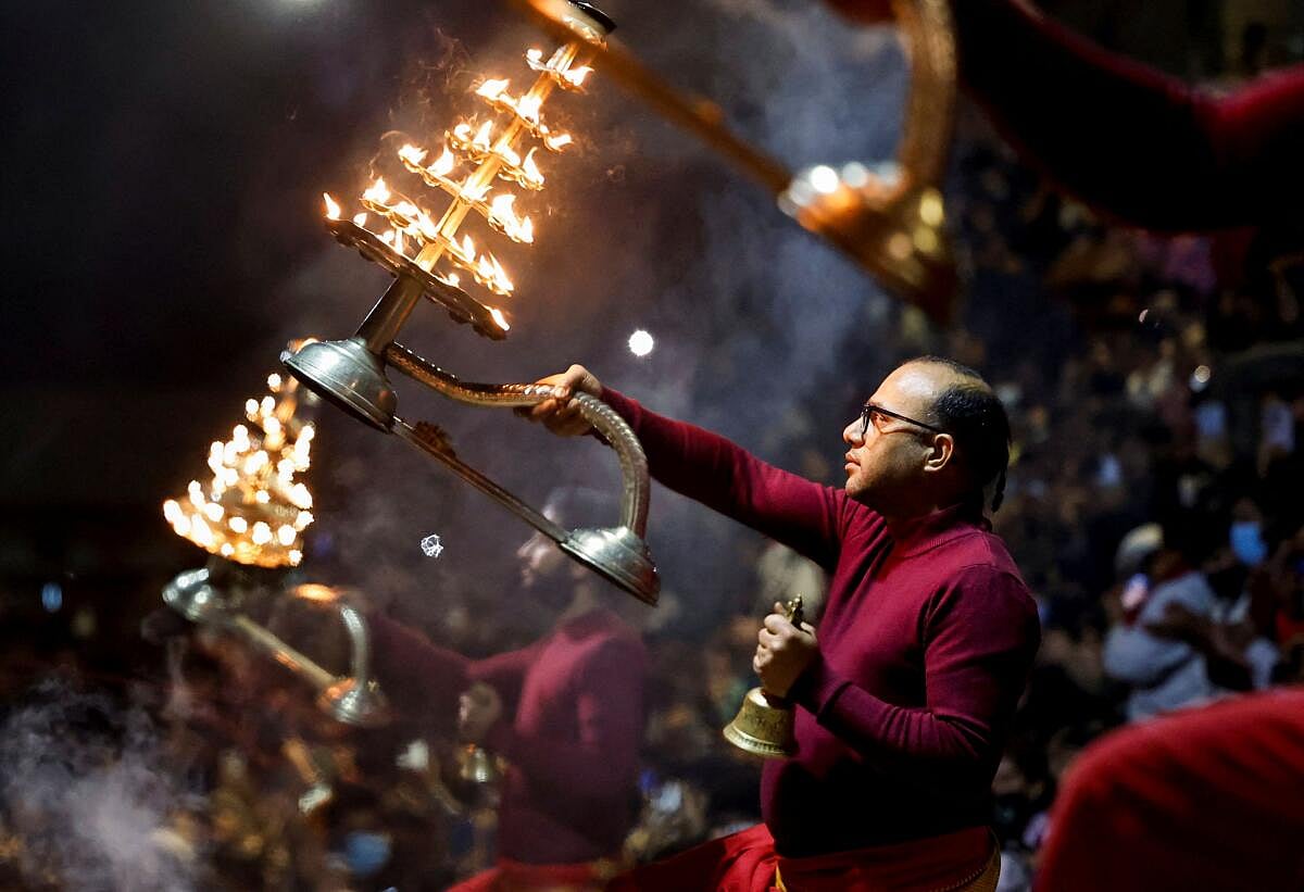 Hindu priests perform "aarati", an offering of light procession, during the Shivaratri festival at the premises of Pashupatinath Temple in Kathmandu, Nepal