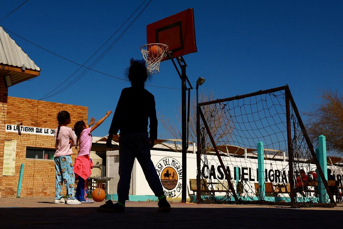 Migrant girls play at the Casa del Migrante shelter, currently housing 74 migrants