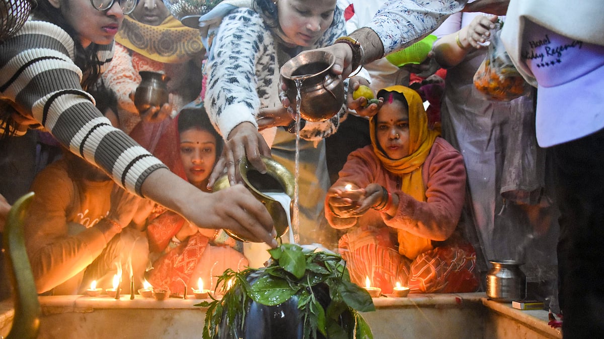 Devotees offer prayers to Lord Shiva at a temple on the occasion of Maha Shivratri in Moradabad.