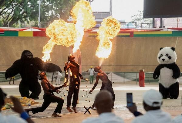 People watch as artists perform during the closing ceremony of the Economic Community of West African States (ECOWAS) African Wrestling Tournament in Abuja, Nigeria.