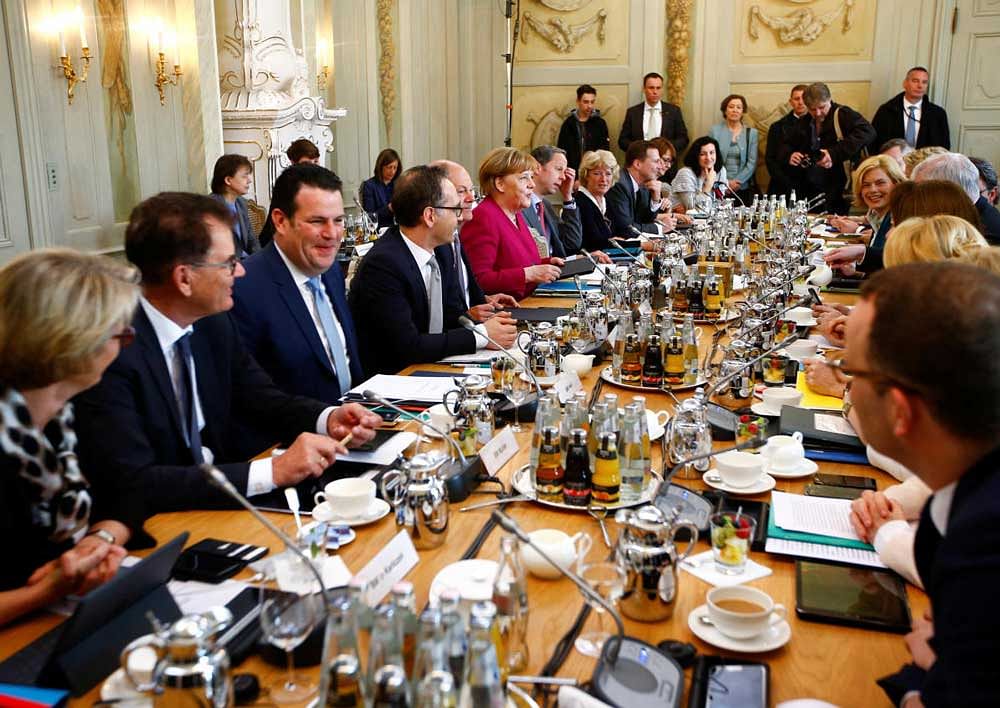 German Chancellor Angela Merkel and Ministers attend at a cabinet session during a retreat at the German government guesthouse Meseberg Palace in Meseberg, Germany. Reuters Photo