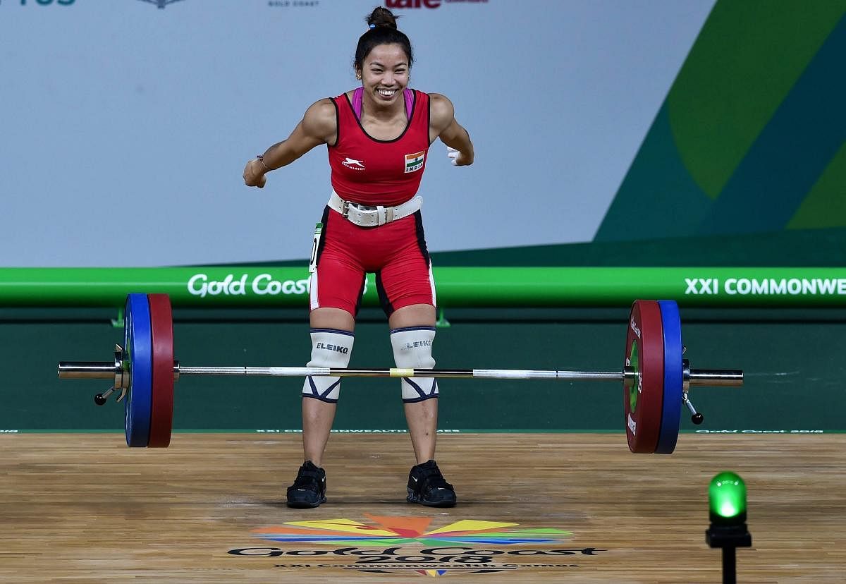 Indian weightlifter Chanu Saikhom celebrates after making a Commonwealth Games record in women's 48kg weightlifting event during the Commonwealth Games 2018 in Gold Coast, on Thursday. (PTI Photo)