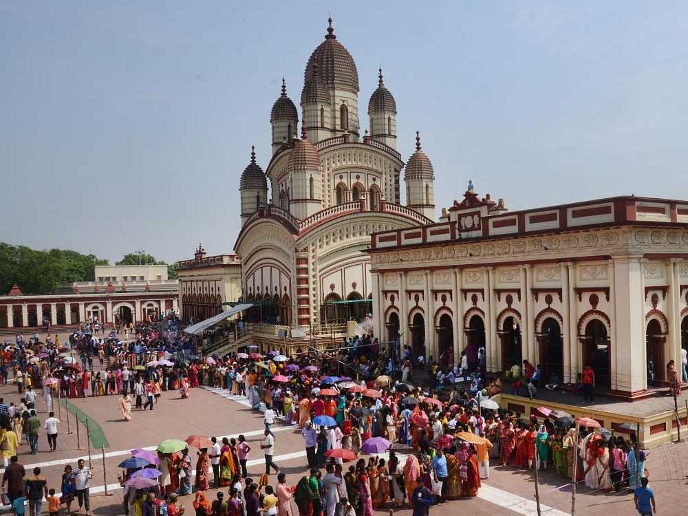 Devotees wait in long queues to offer prayers on the occasion of Bengali New Year at Dakshineswar temple, Kolkata. PTI Photo