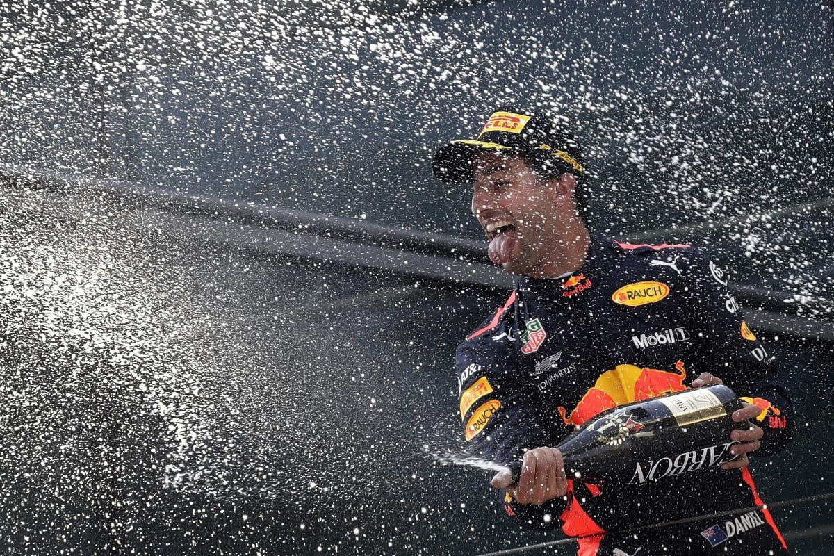 Red Bull driver Daniel Ricciardo of Australia celebrates with champagne on the podium after winning the Chinese Formula One Grand Prix at the Shanghai International Circuit in Shanghai, Sunday, April 15, 2018. AP/PTI