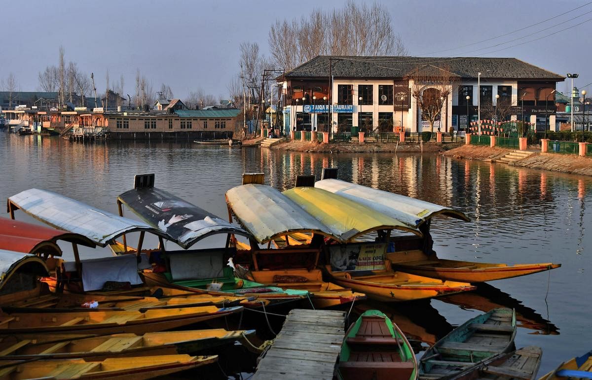 Gulshan Books, a publishing house with the book of Limca Records, inside Dal Lake at Nehru Park in Srinagar on Sunday. The book shop, with collection of 80,000 books, was recently included in Limca Book for being the only library in the country setup on a lake. PTI Photo by S Irfan