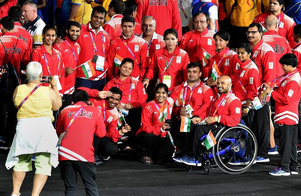 Gold medallist boxer MC Mary Kom with other memers of the Indian contingent during the closing ceremony of Commonwealth Games 2018, Gold Coast, Australia, on Sunday. PTI
