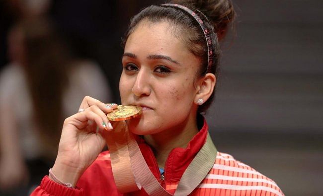 Table tennis gold medalist Manika Batra of India poses with medal. (REUTERS)