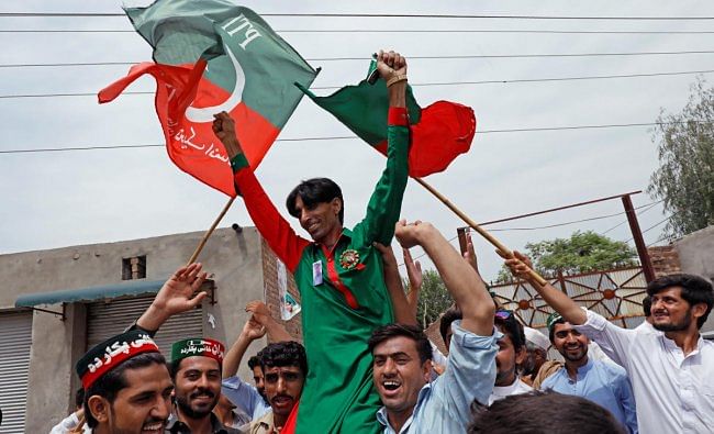 Supporters of Imran Khan, chairman of the Pakistan Tehreek-e-Insaf (PTI) party, celebrate a day after the general election, in Peshawar, Pakistan. (Reuters Photo)
