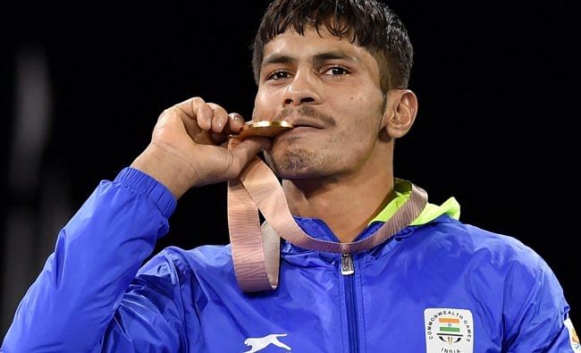 Gold medalist India's Rahul Aware during the medal ceremony of men's freestyle 57kg wrestling final at the Commonwealth Games 2018 in Gold Coast, on Thursday. (PTI Photo)