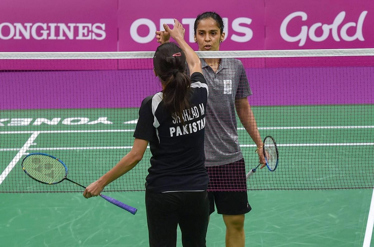 Indian shuttler Saina Nehwal in action against Pakistani player Mahoor Shahzad at Badminton women's singles in Mixed Team event during the Commonwealth Games 2018 in Gold Coast, on Thursday. (PTI Photo)