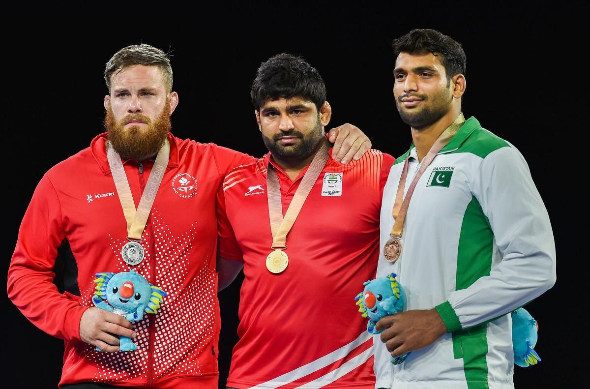 Gold medalist India's Sumit during the medal ceremony of MFS 125kg wrestling Nordic at the Commonwealth Games 2018 in Gold Coast, Australia on Saturday. (PTI Photo)