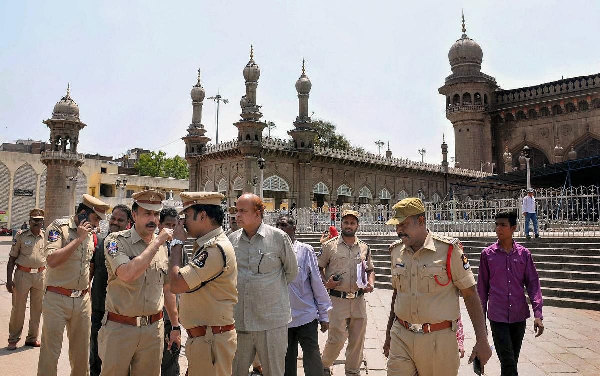 South Zone DCP V Satyanarayana along with other officials at the historic Mecca Masjid in old city of Hyderabad on Monday. A Special NIA court on Monday acquitted all accused in 2007 Mecca Masjid blast case. PTI