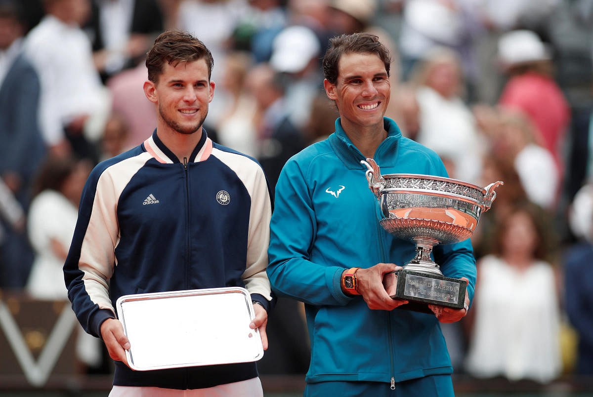 Nadal wins 11th French Open despite late injury scare