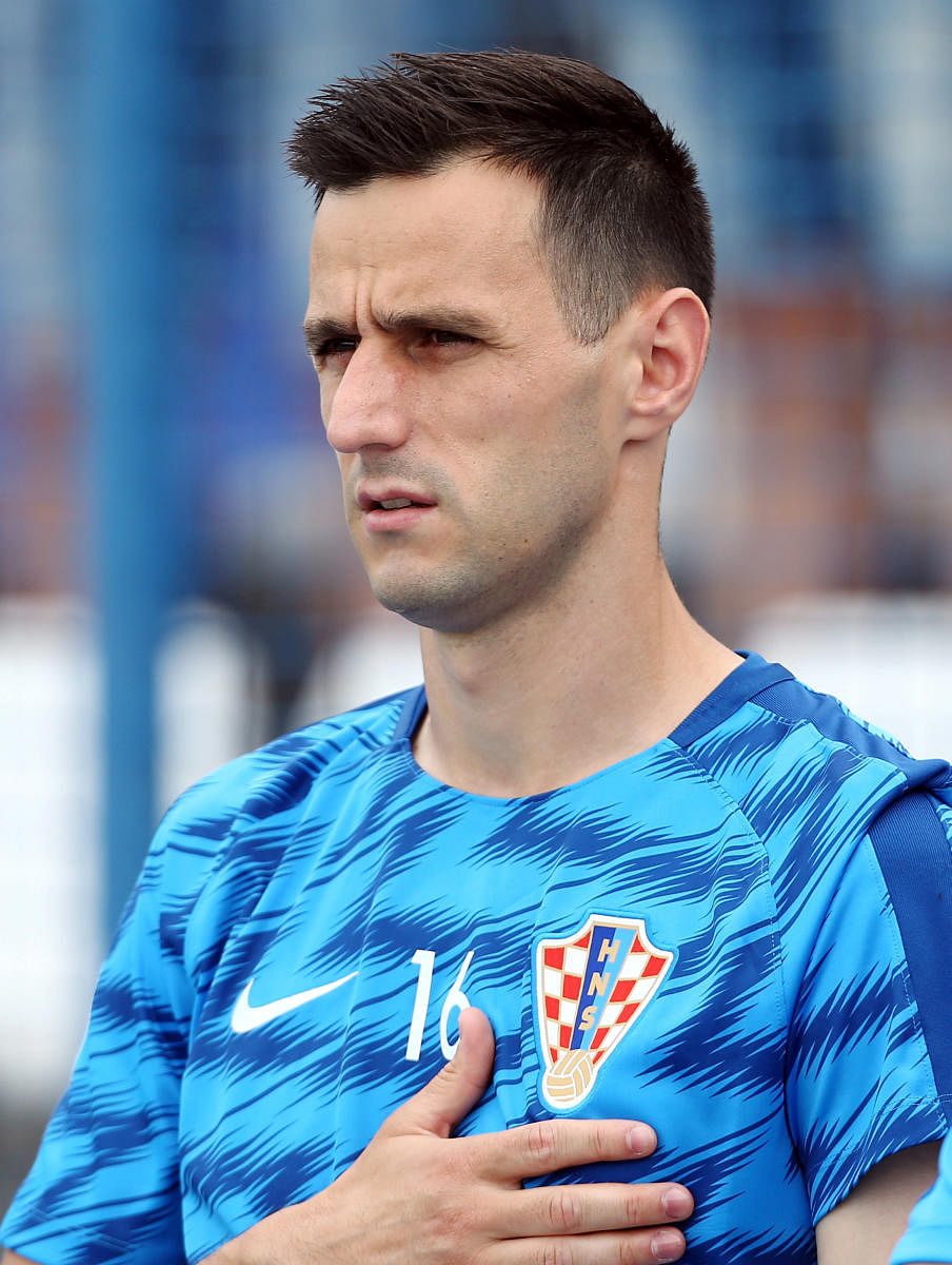 Croatia's injured Kalinic returns home