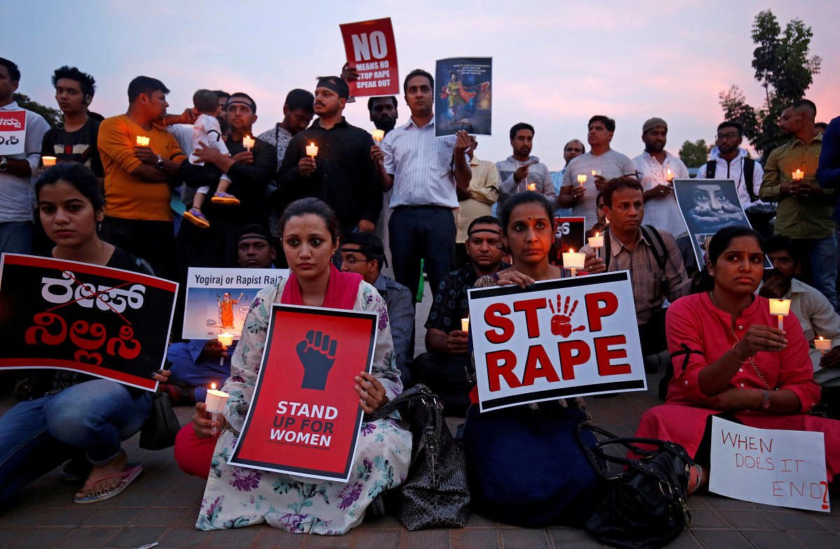 People participate in a candle light vigil as they protest against the rape of an eight-year-old girl in Kathua near Jammu,and a teenager in Unnao, Uttar Pradesh state, in Bengaluru. (Reuters File Photo)