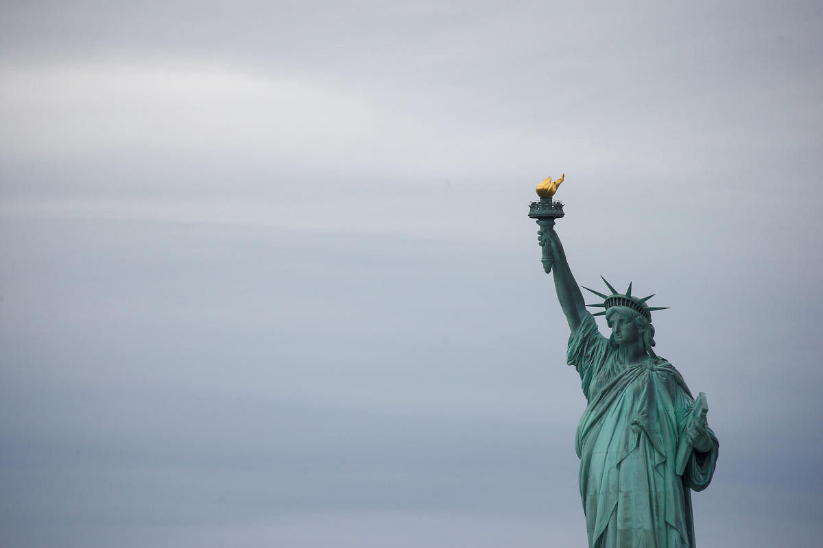 Woman climbs base of Statue of Liberty, arrested