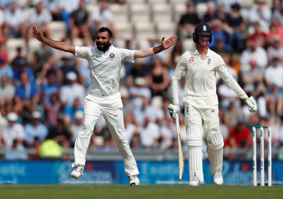 Mohammed Shami celebrates taking the wicket of England's Keaton Jennings (R). Credit: Action Images via Reuters/Paul Childs