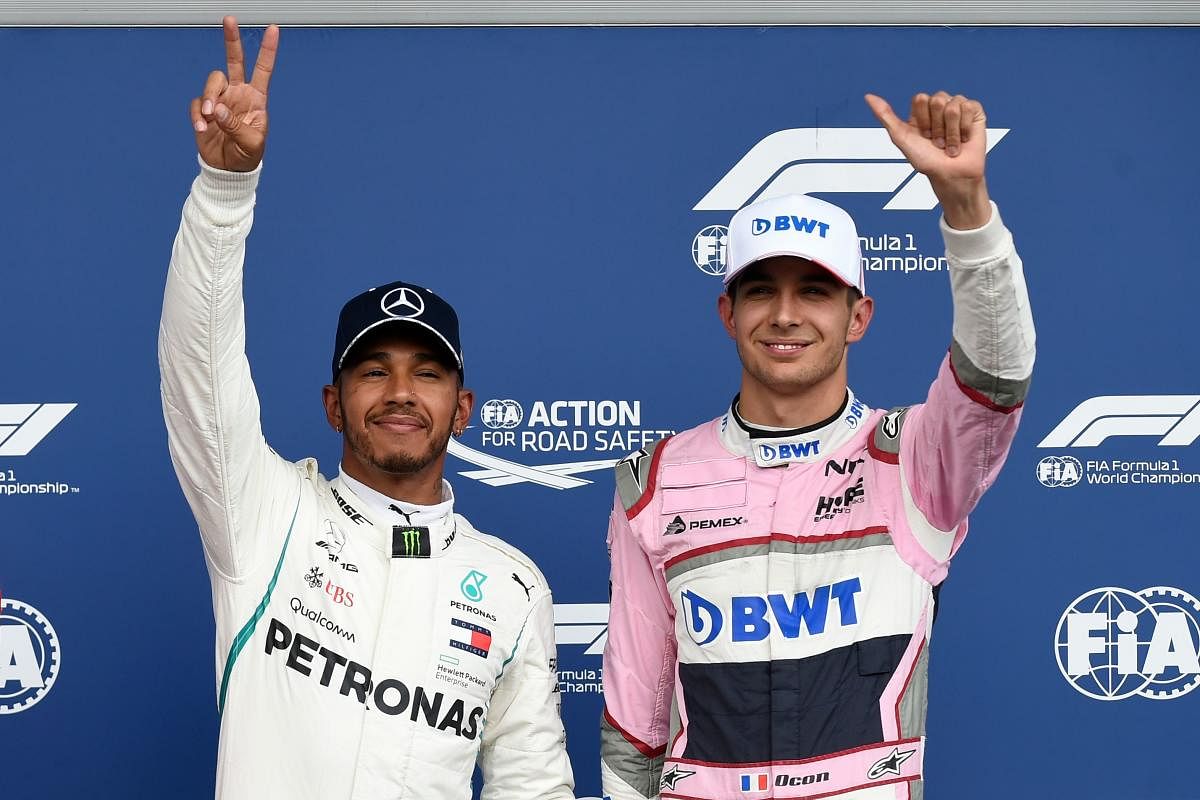 Hamilton snatches pole in rain-hit qualifying