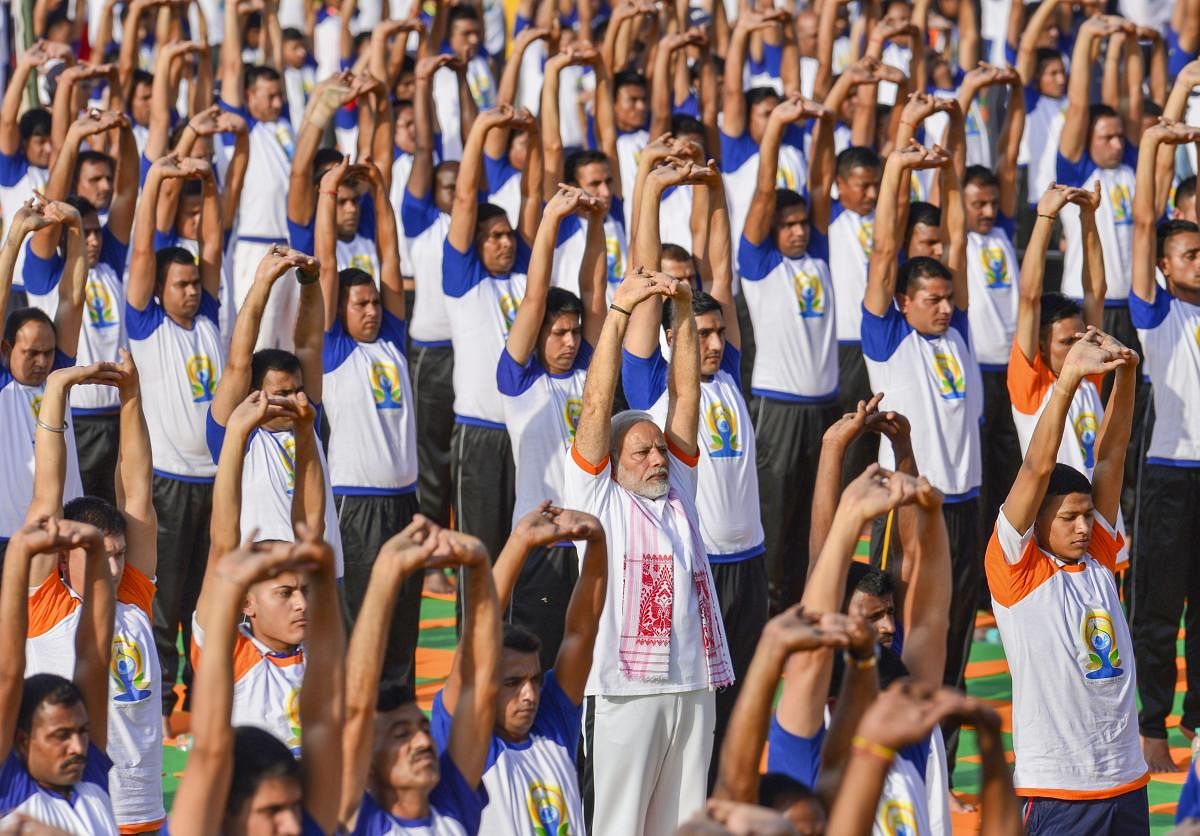 Yoga powerful unifying force in strife-torn world: Modi