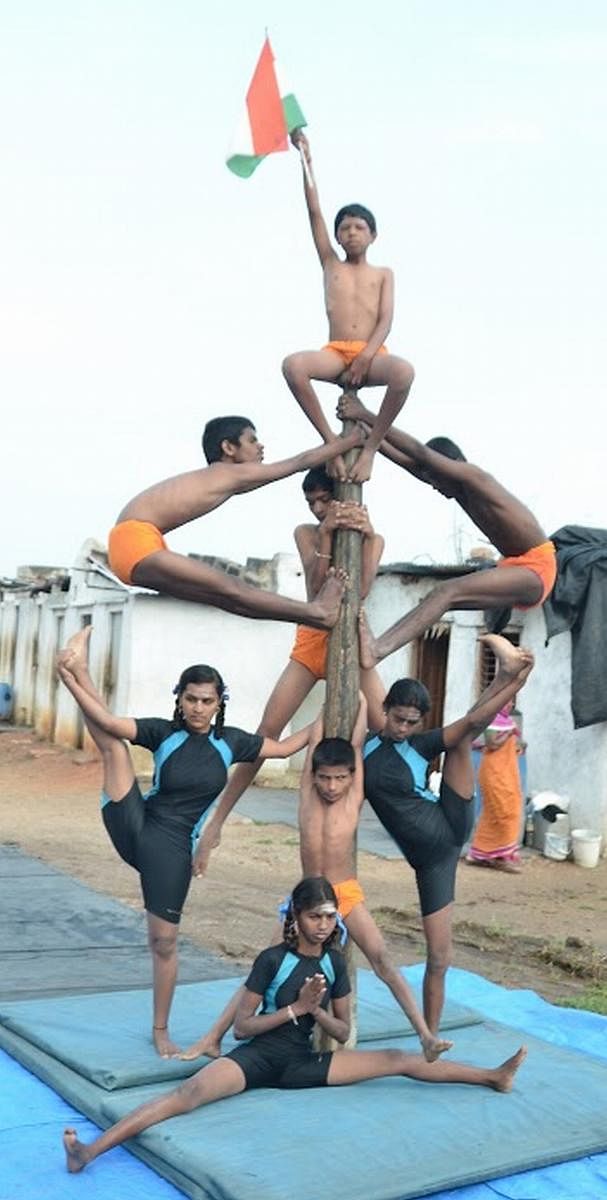 Visually challenged students performing acrobats.