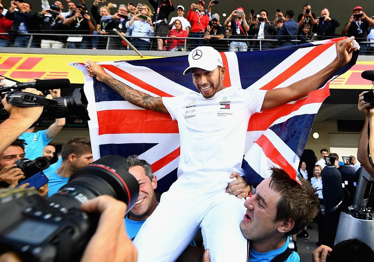 Hamilton joins Fangio with 'surreal' fifth world title
