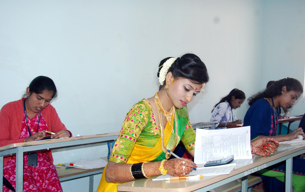 Bride takes exam in wedding attire