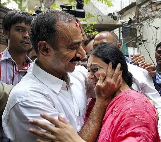 Suspended IPS officer Sanjiv Bhatt hugs his wife Shweta after his release from Sabarmati Central Jail. (PTI Photo)