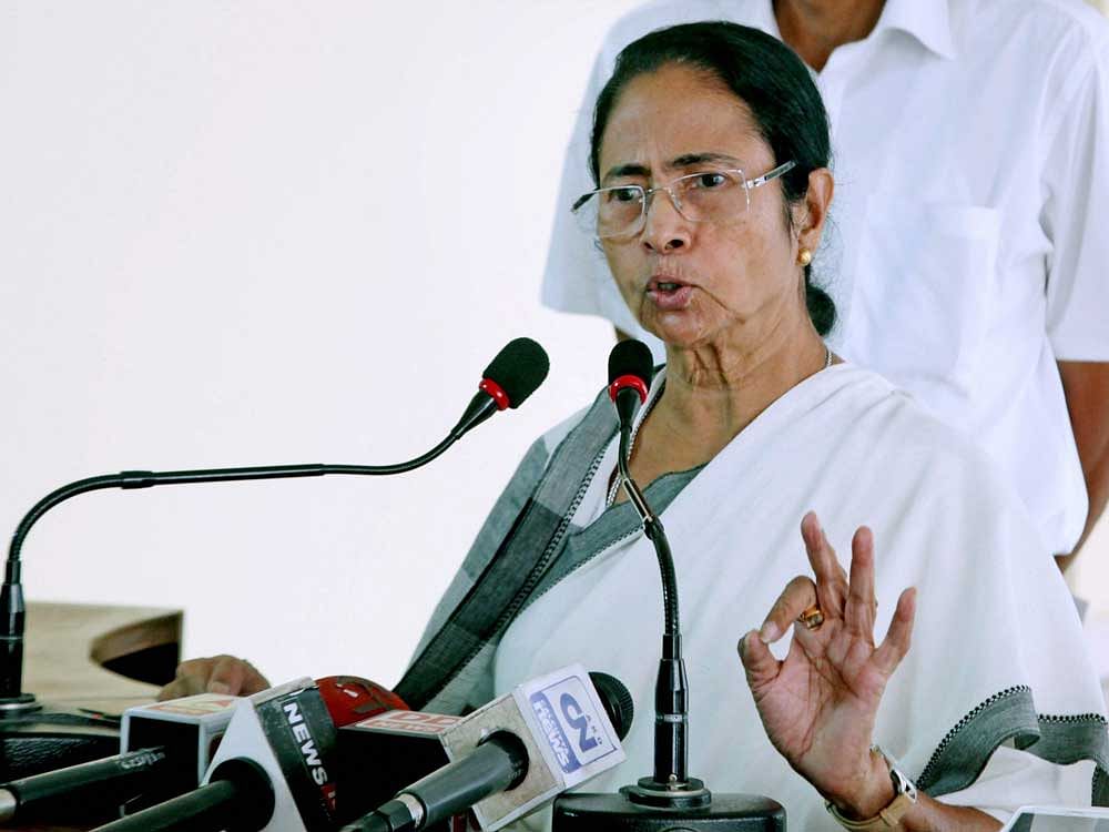 Mamata hails BJP's setback, mum on Congress' success