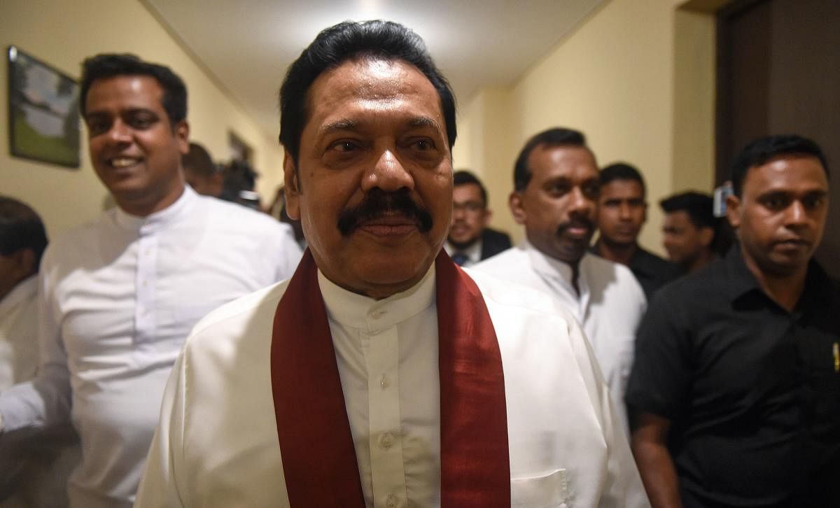 Sri Lanka's disputed premier Rajapakse steps down