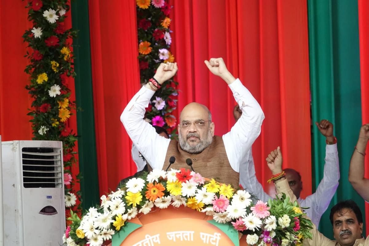 Shah asks workers to root out Congress