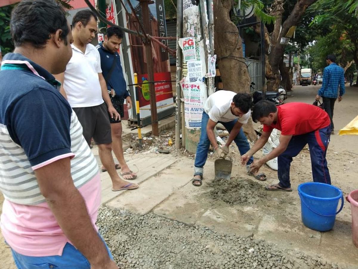 Ignored by BBMP, residents fix footpath using their own funds 