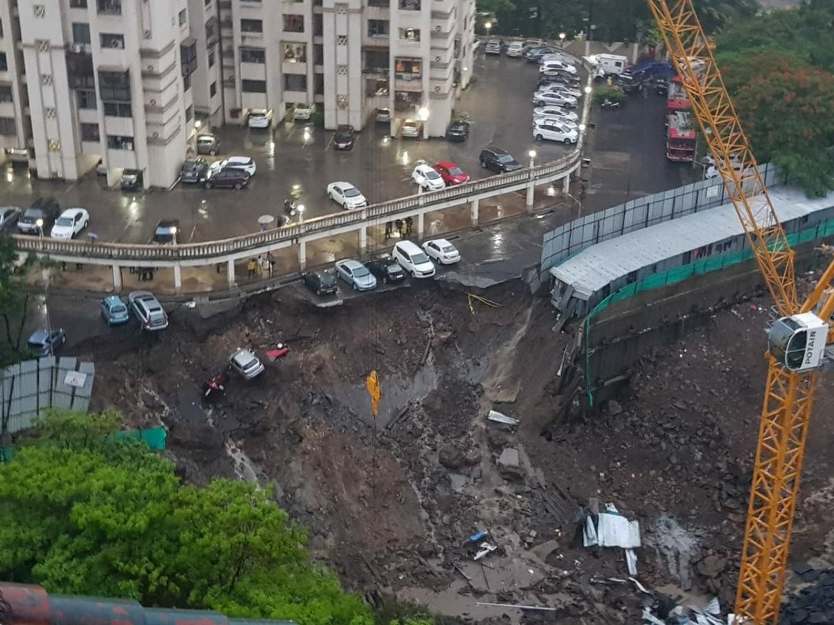 Mumbai rain: driveway caves in at Antop Hill high rise