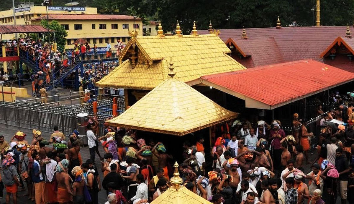 SC opens Sabarimala temple door to women