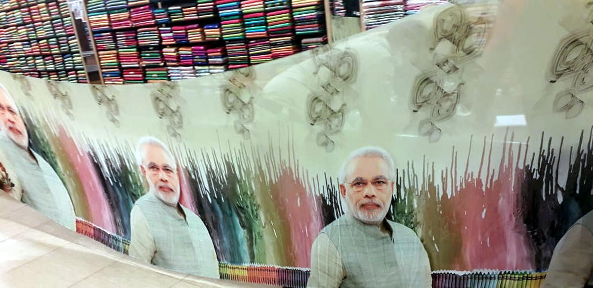 Raid on showroom selling sarees with Modi picture