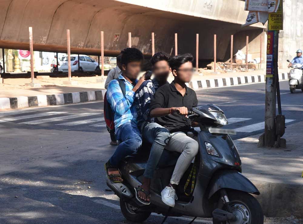 Trio riding triple attacks traffic constable