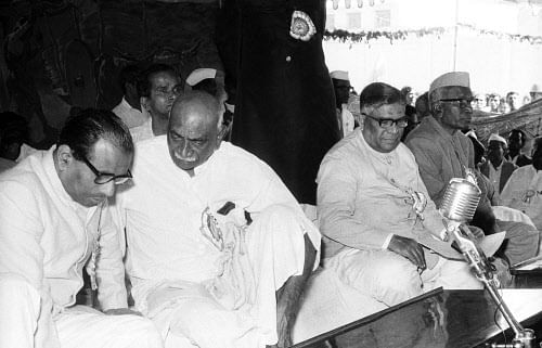 Jan 22, 1975: Veerendra Patil and K Kamaraj discussing at Backward class and minoritiesconference organised by KPCC, K S Hegde former Justice supreme court and others wereseen on the dais.