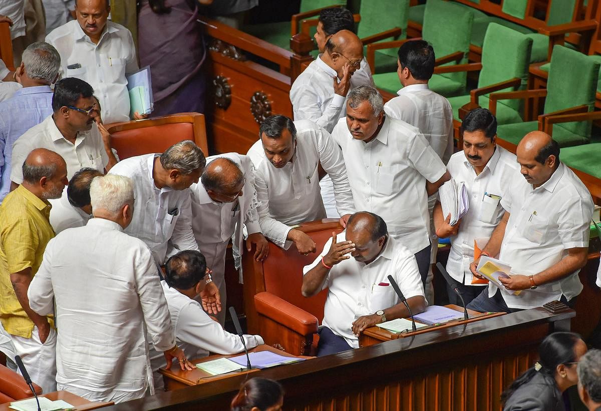 Bengaluru: Karnataka Chief Minister H D Kumaraswamy and his deputy G Parameshwara with othermembers during the Assembly session at Vidhana Soudha in Bengaluru,Monday, July 15, 2019. (PTI File Photo)