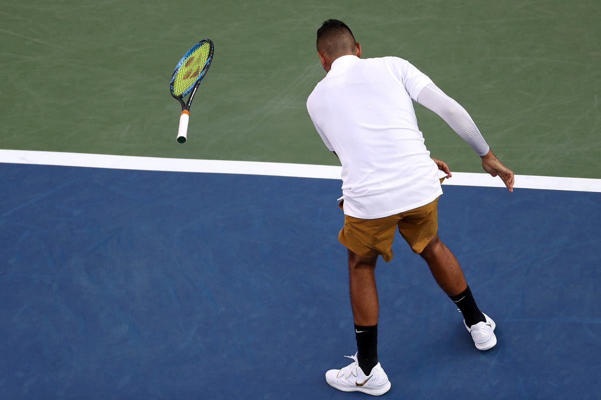 Fiery Kyrgios smashes racquets, tosses shoes in loss