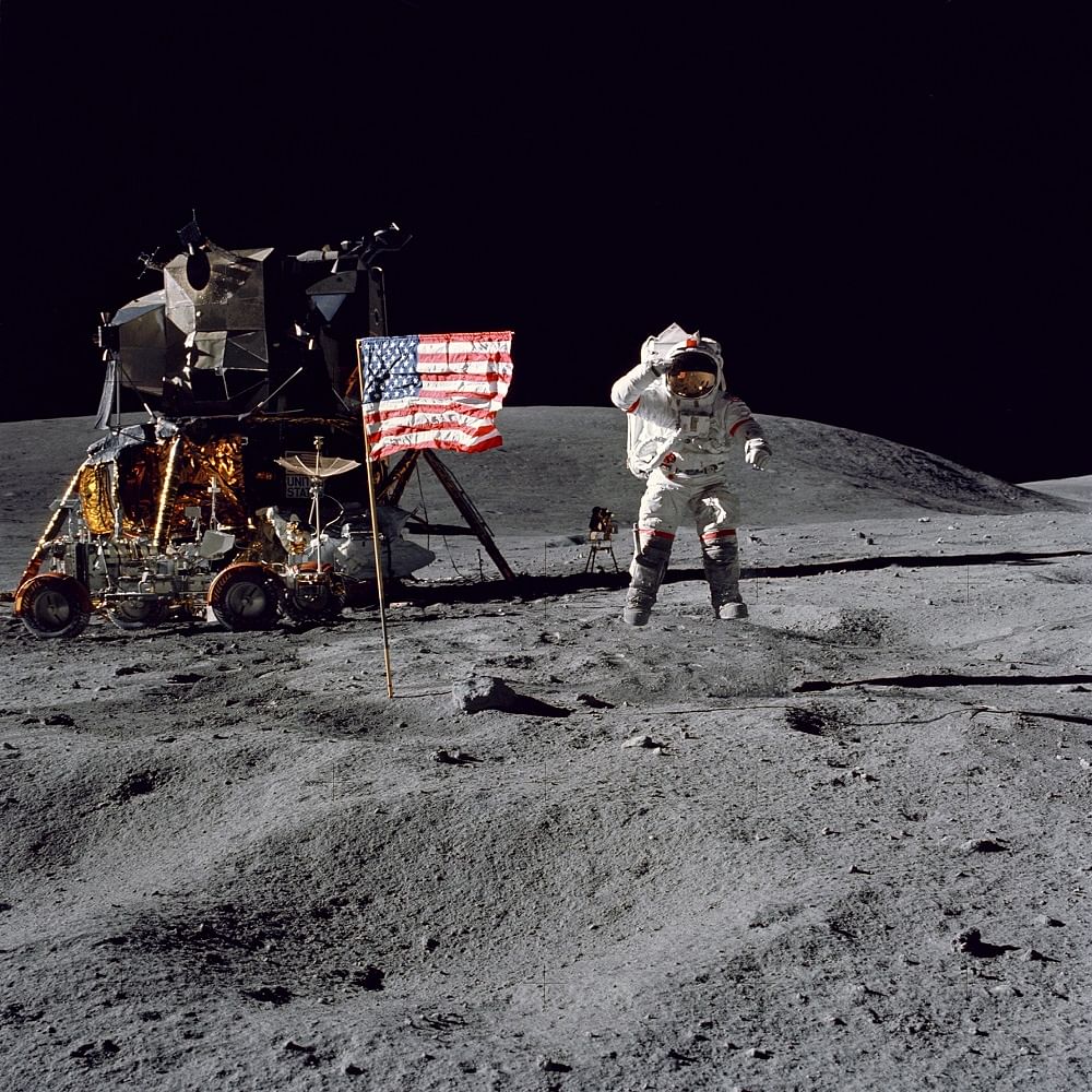 Commander John W. Young, salutes the United States flag during the mission’s first extravehicular activity. (Photo: NASA)