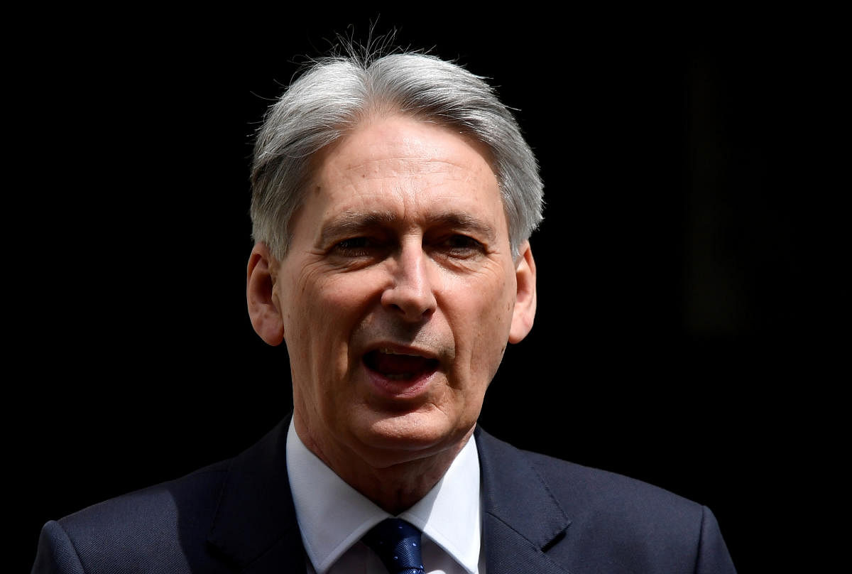 Former UK FM Hammond to stand down as lawmaker