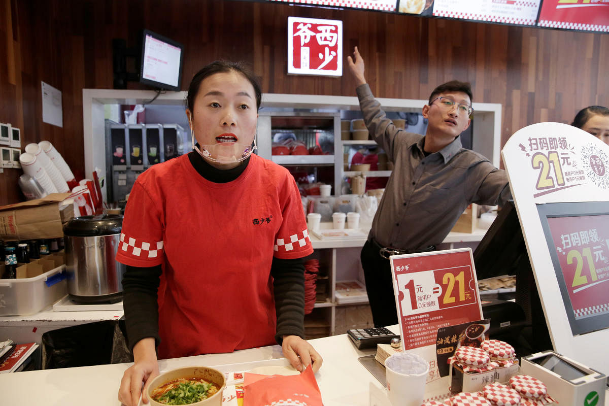 China's restaurants feel the heat, pork supplies plunge