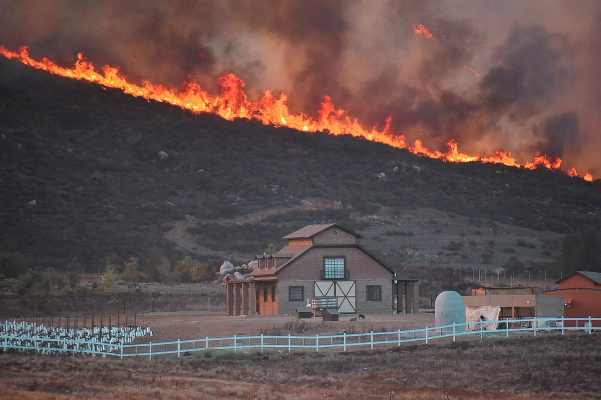 California orders evacuation of 50,000 as fires spread