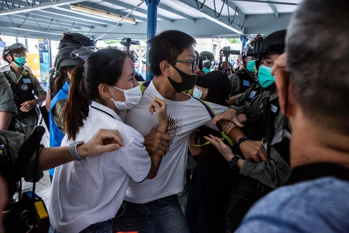 Hong Kong police grapple with pro-democracy protesters