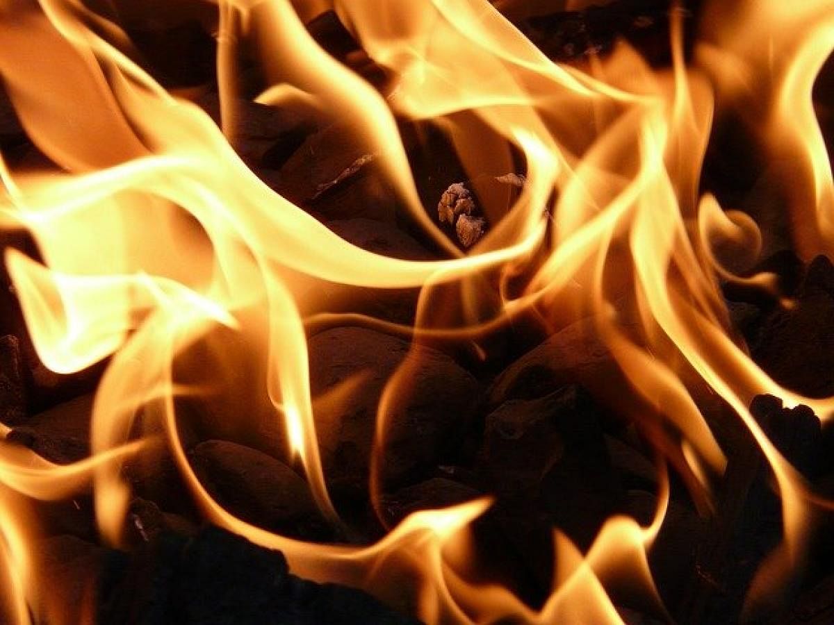 Man set afire by colleague's live-in partner