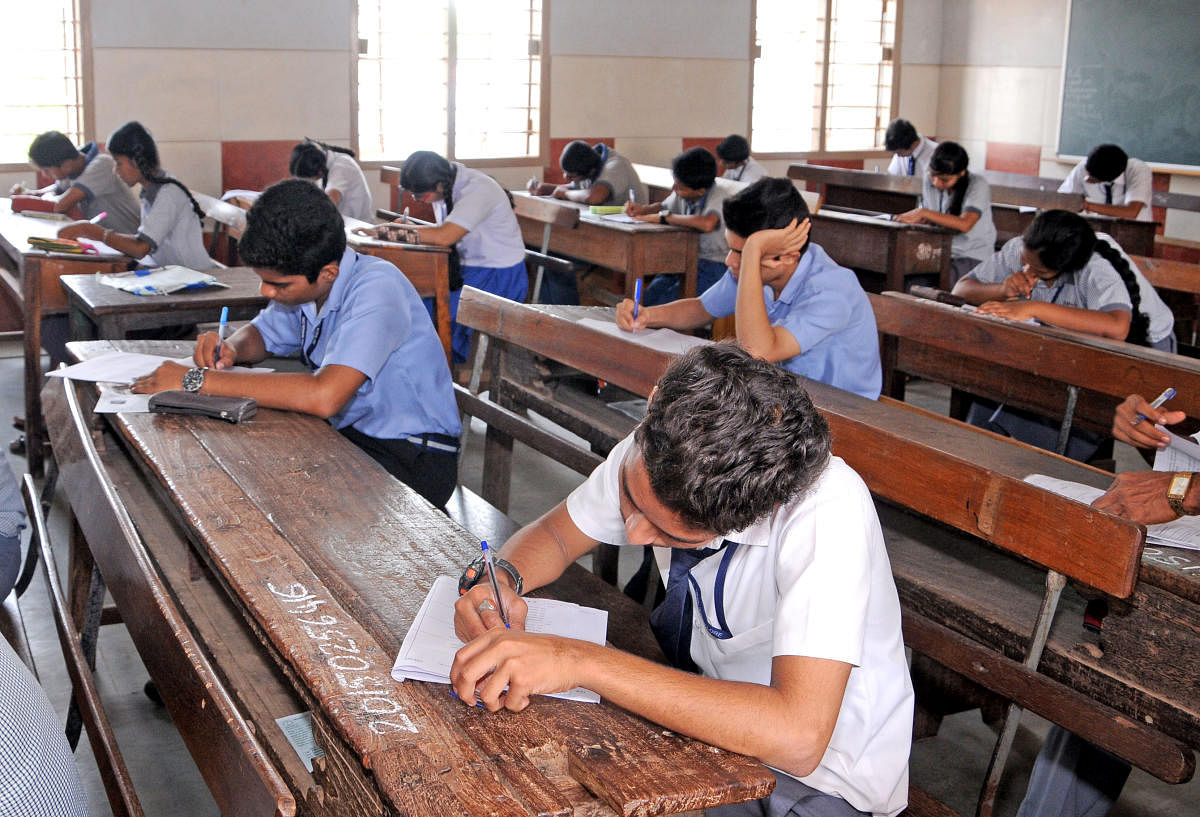 Students writing the SSLC exams. A mass copying incident was reported from Bagalkot this year. Representative photo/ Govindraj Javali