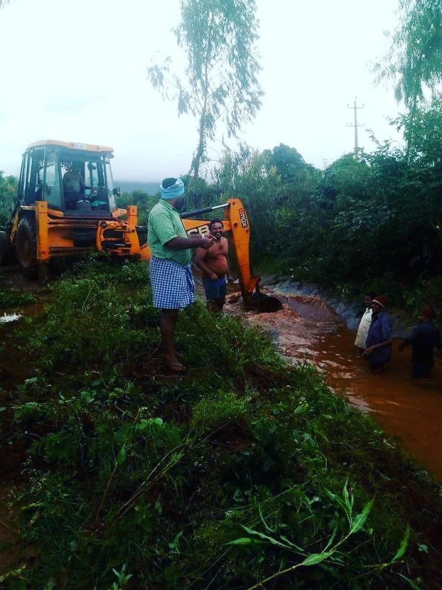 Villagers in Kadur clean canal