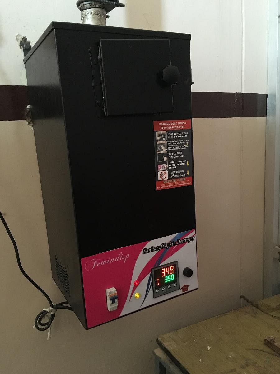 Sanitary napkin vending machine at HC