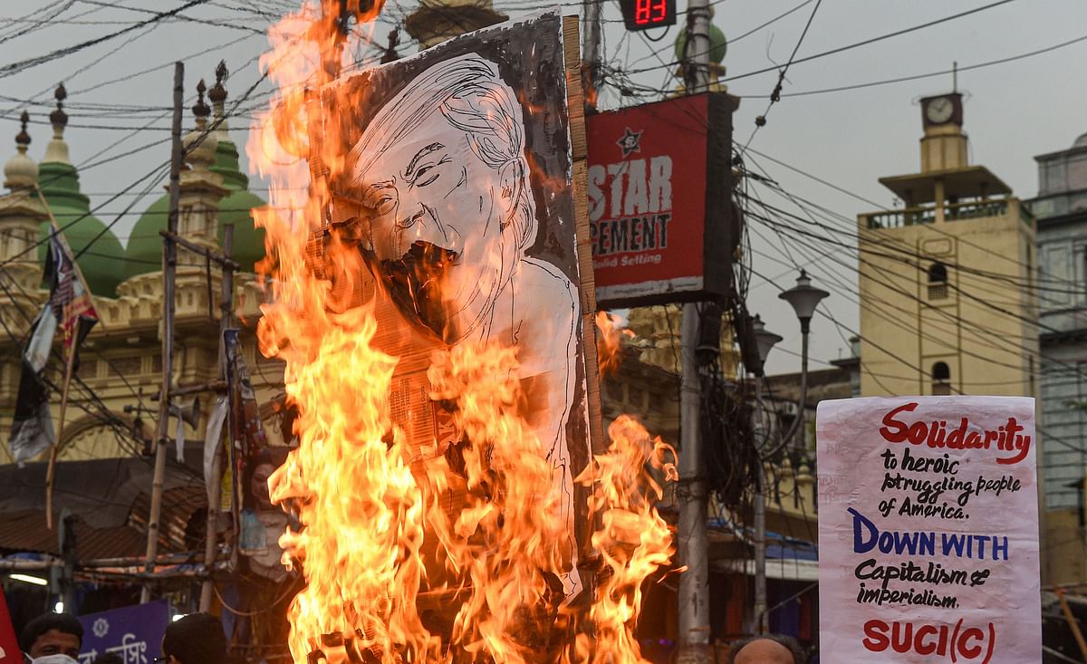 SUCI (C) activists burn an effigy of US President Donald Trump as they stage a protest rally to express solidarity with the people of America, on the first day of COVID-19 lockdown 5.0, in Kolkata, Monday, June 1, 2020. (PTI Photo)