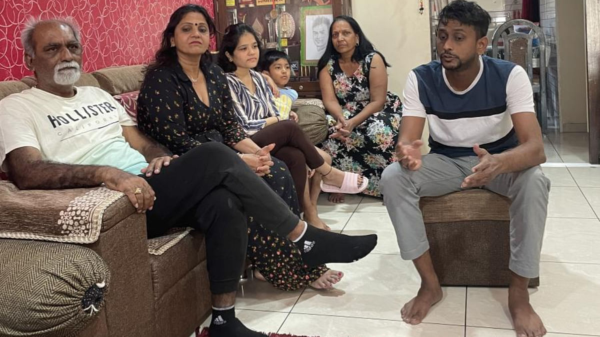 Axar Patel's parents (from left) Rajeshbhai, Preity, his cousin Sanship (right) and other family members. Credit: DH Photo